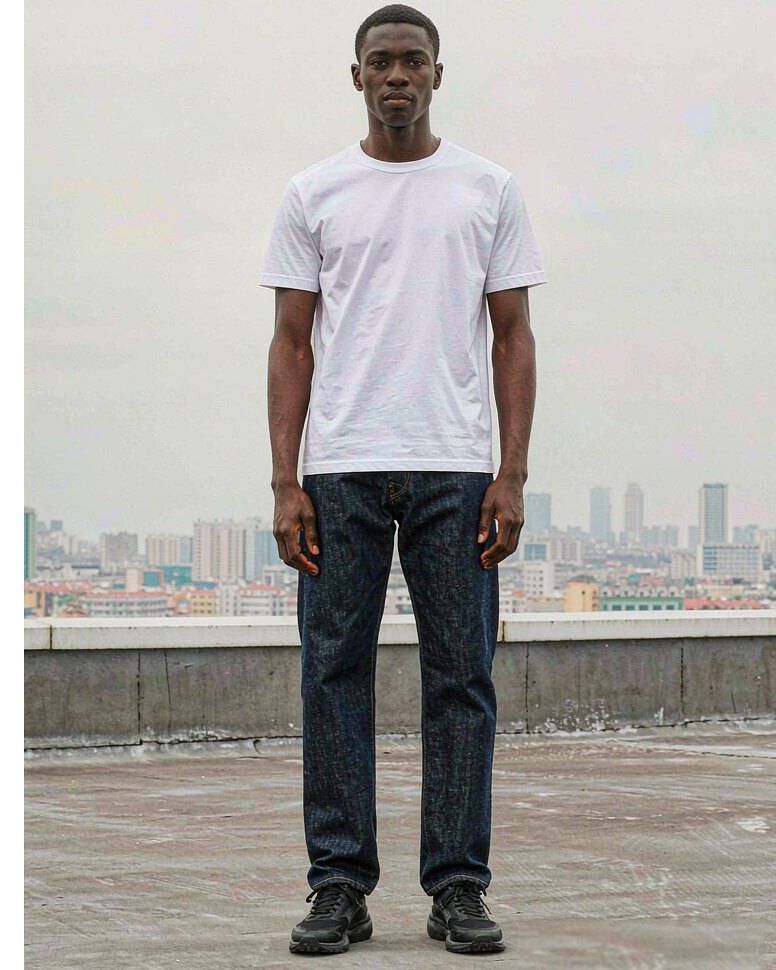 Denim Jean in Mid Indigo worn by a model