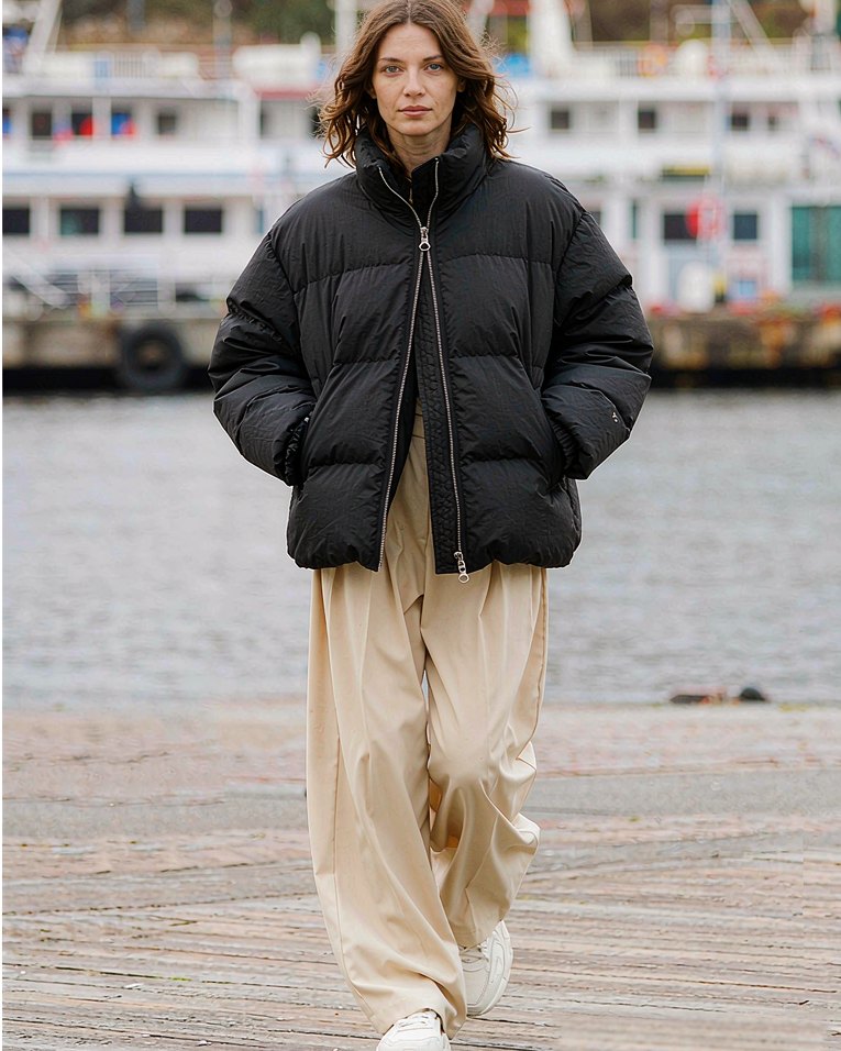 Puffer Jacket in Black worn by a model